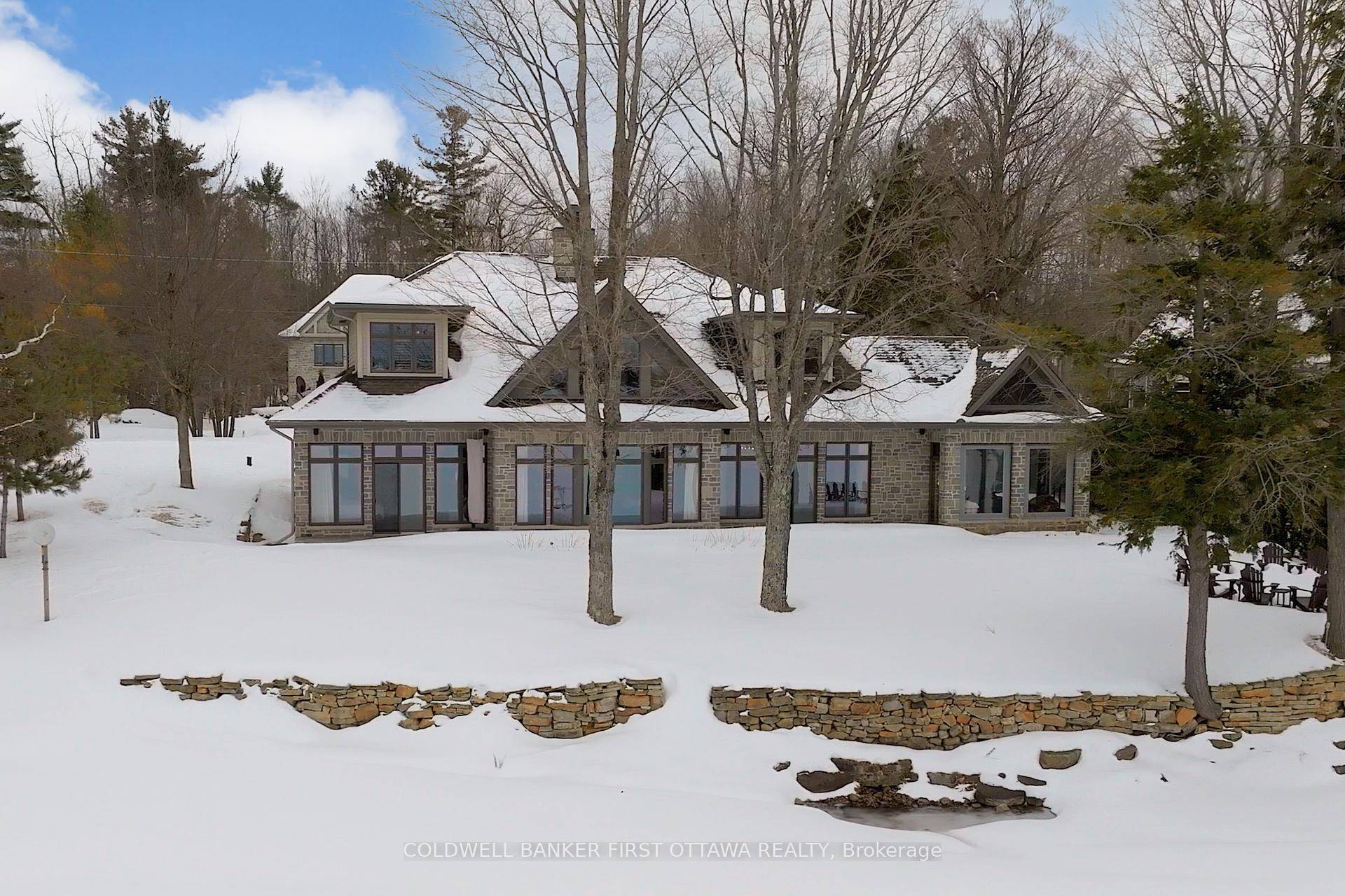 This luxury custom built waterfront home is a true masterpiece, blending elegance and functionality.