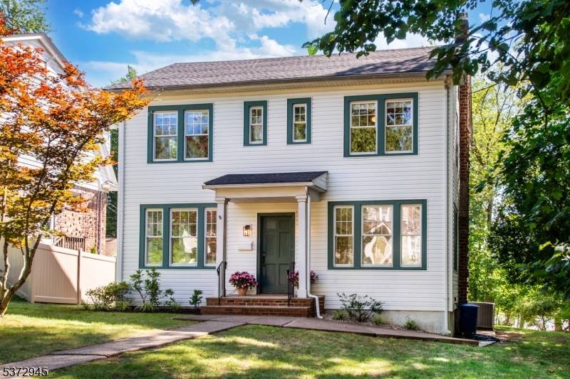 Light, space, and flexibility define this inviting colonial on a lovely tree lined street.