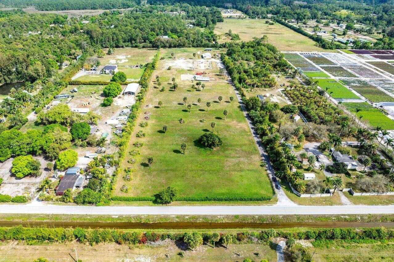 Welcome to 2962 D Road, a premier 10 acre equestrian estate in Loxahatchee Groves, Florida.