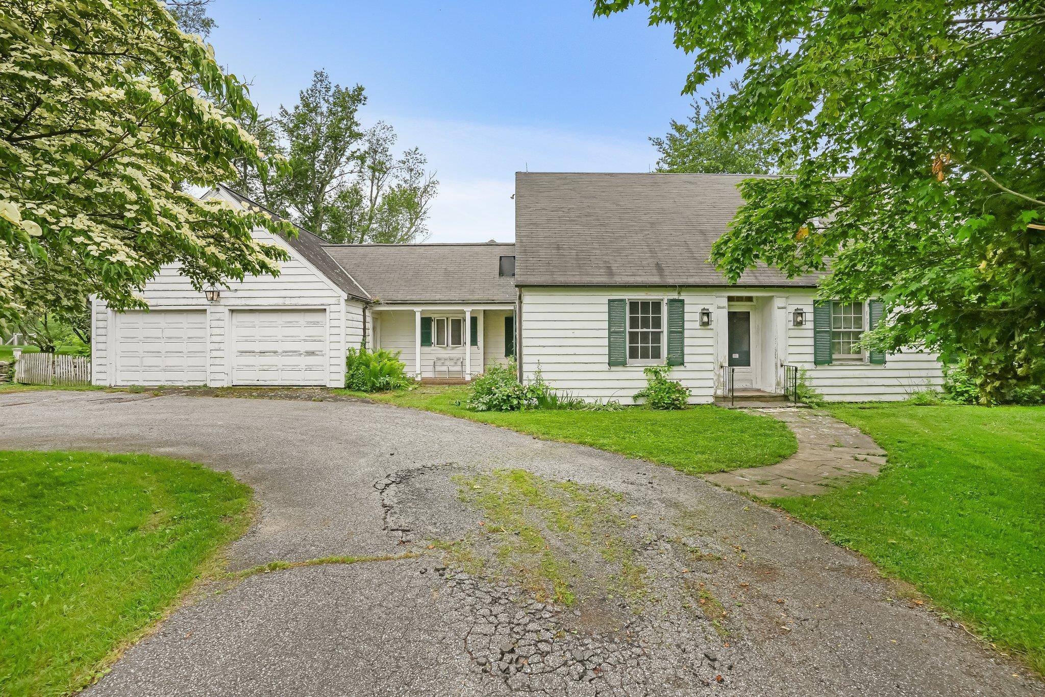 A Stately Cape Cod Estate with Exceptional Potential awaits.