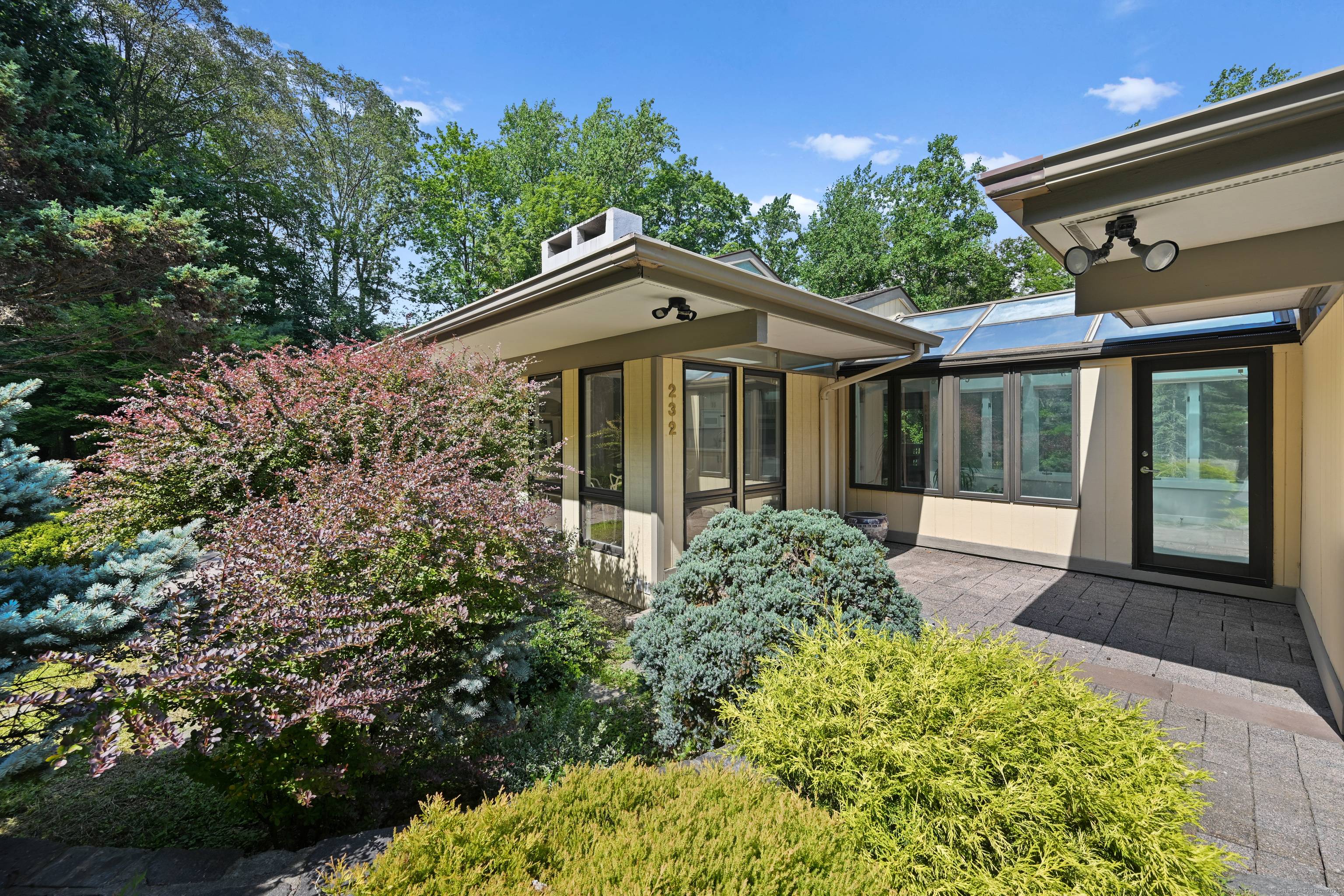 Nestled at the end of a peaceful cul de sac, this striking contemporary residence offers nearly 4, 500sq ft of sun drenched living space, thoughtfully designed for modern living.