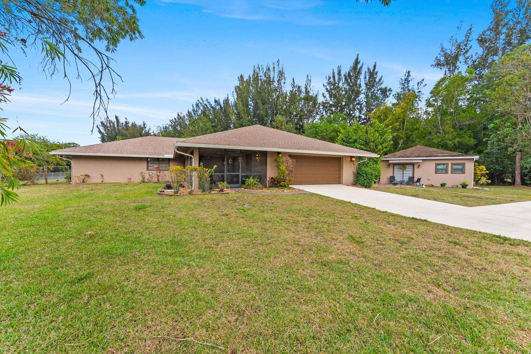Beautifully remodeled in 2022, this spacious home with a detached guest house sits on an oversized 1.
