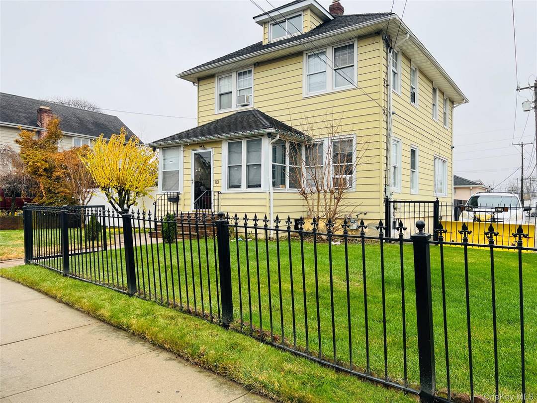 Beautiful large home, updated kitchen, new storm windows, hardwood and ceramic tiled flooring throughout front and back porches seated on an extra large lot.