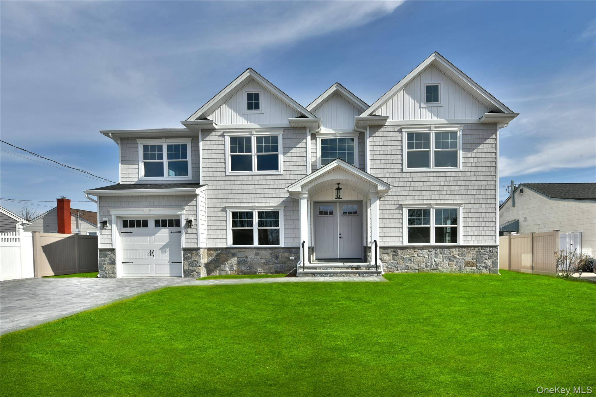 Welcome to this magnificent newly constructed center hall colonial set on a 7550 Sq.