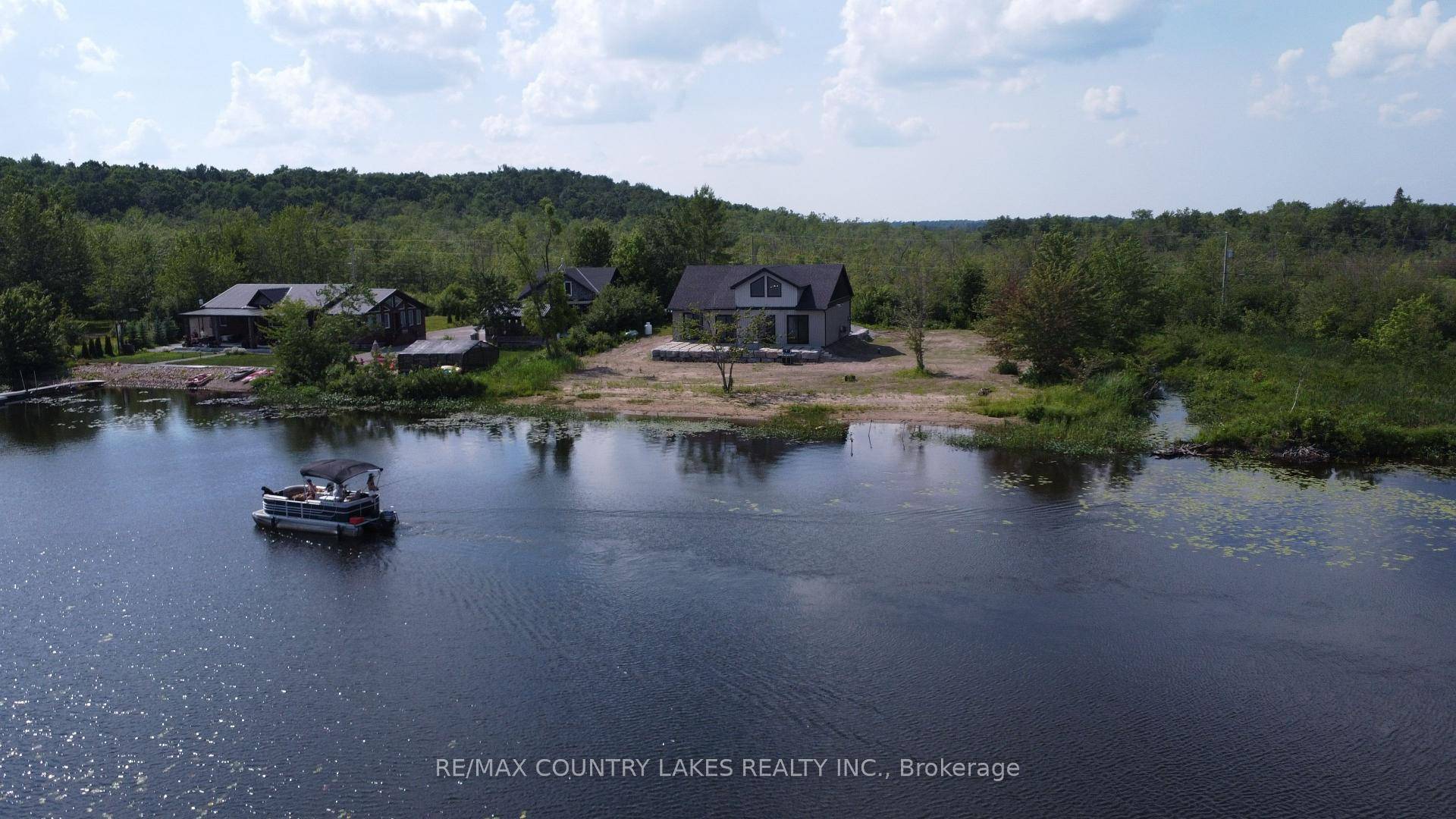 This exceptional 4 bedroom, 4 year old custom built home boasts 171 feet of prime waterfront on the serene shores of Head Lake.