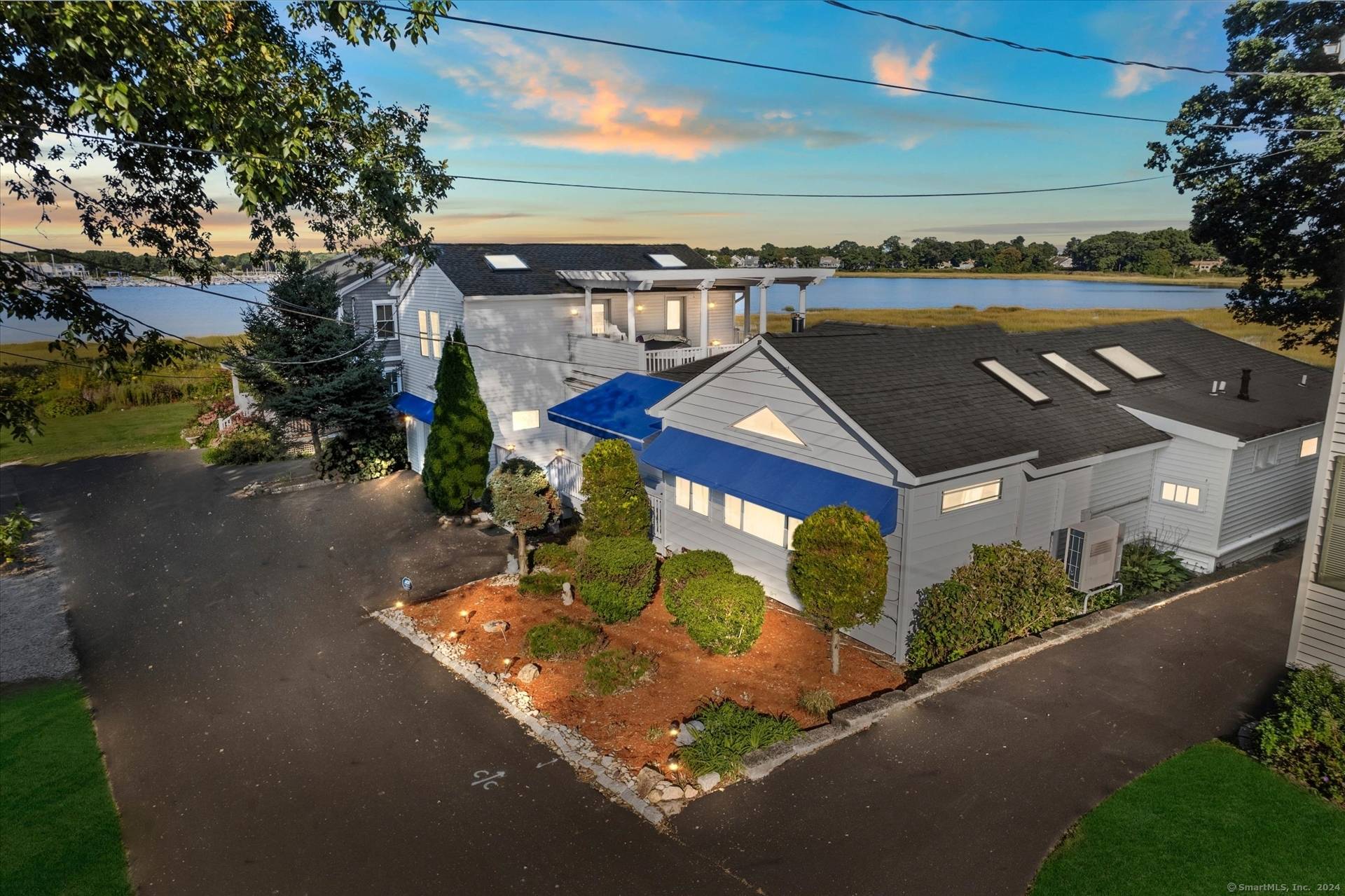 Experience year round living in this beautifully appointed waterfront home offering panoramic bay views, deeded beach rights, and resort style amenities.