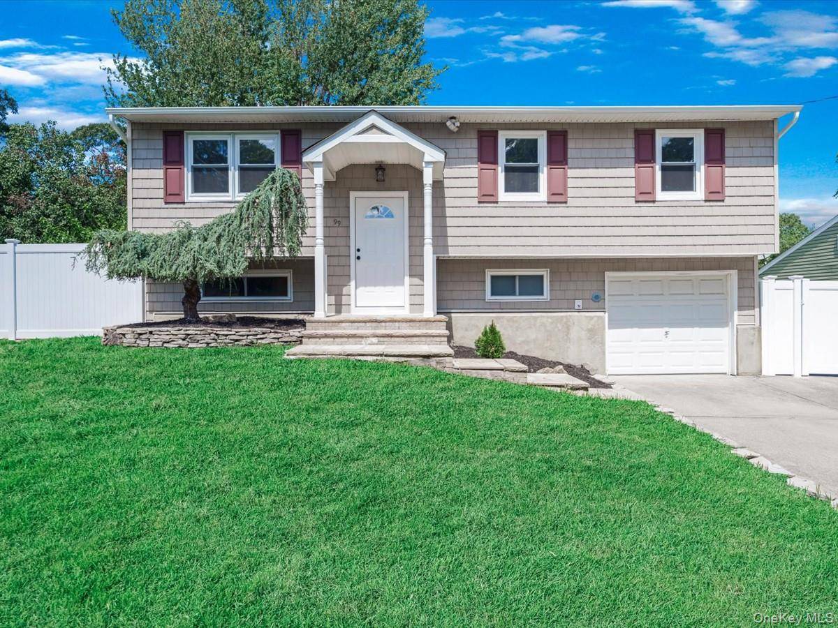 Located in the heart of Selden, this beautifully renovated 4 bedroom, 2 bath home blends modern sophistication with everyday comfort.