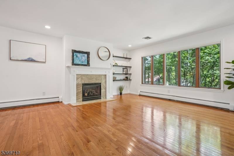 Welcome to 15 Woglum Place, a beautiful home tucked on a peaceful cul de sac in the heart of Berkeley Heights.