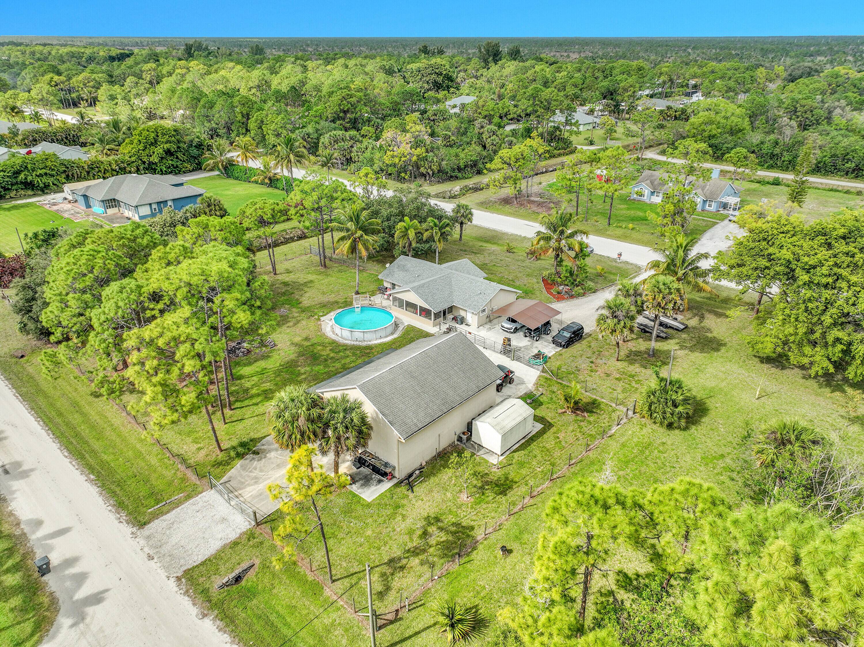 Luxury Acreage Living with an Enthusiast's Dream Workshop Equestrian Potential !