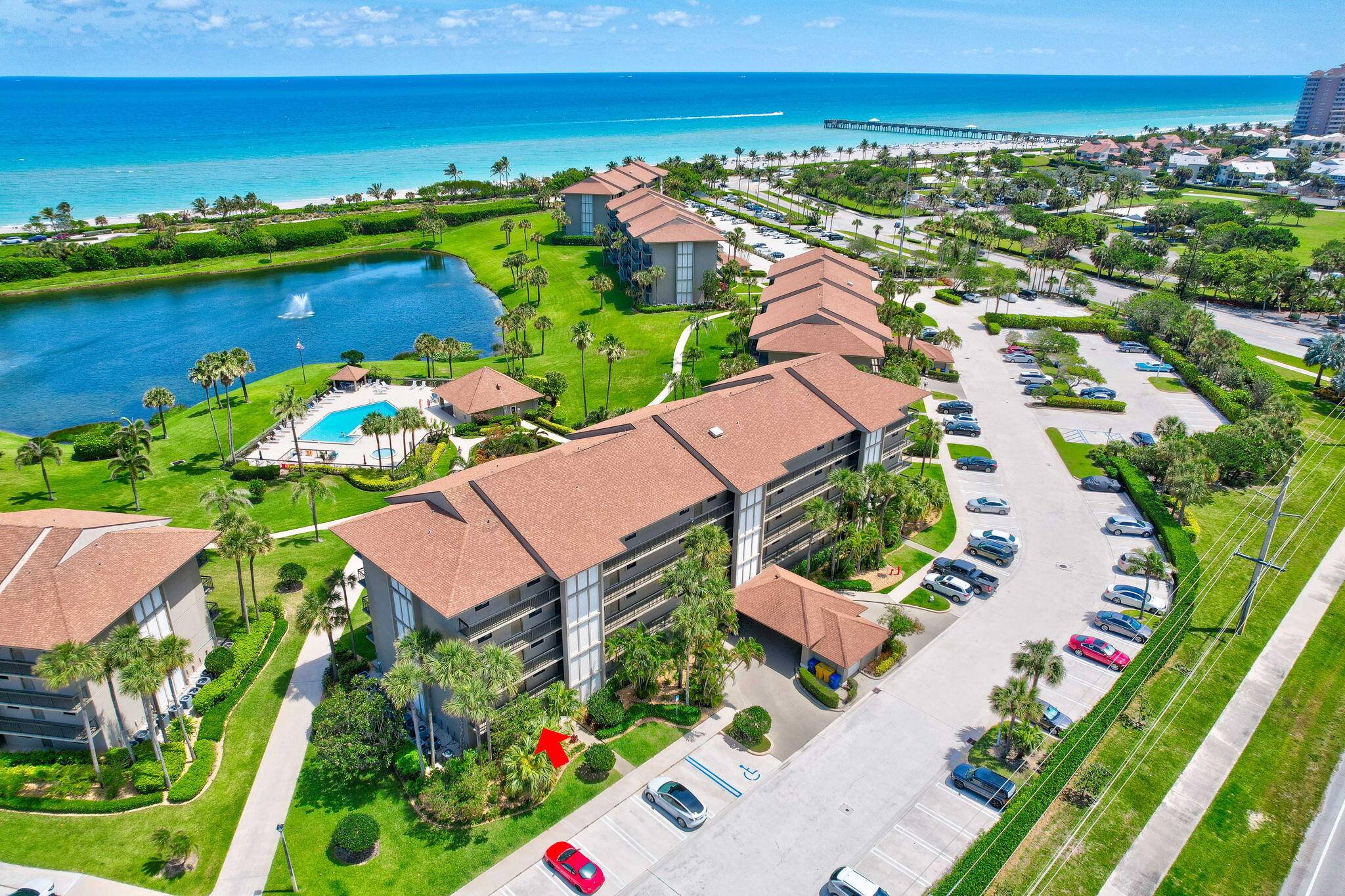 FULLY FUNDED COA Best buy in the community East facing end unit with easy access to the pool and white sand ocean overlooking the pool and lake.