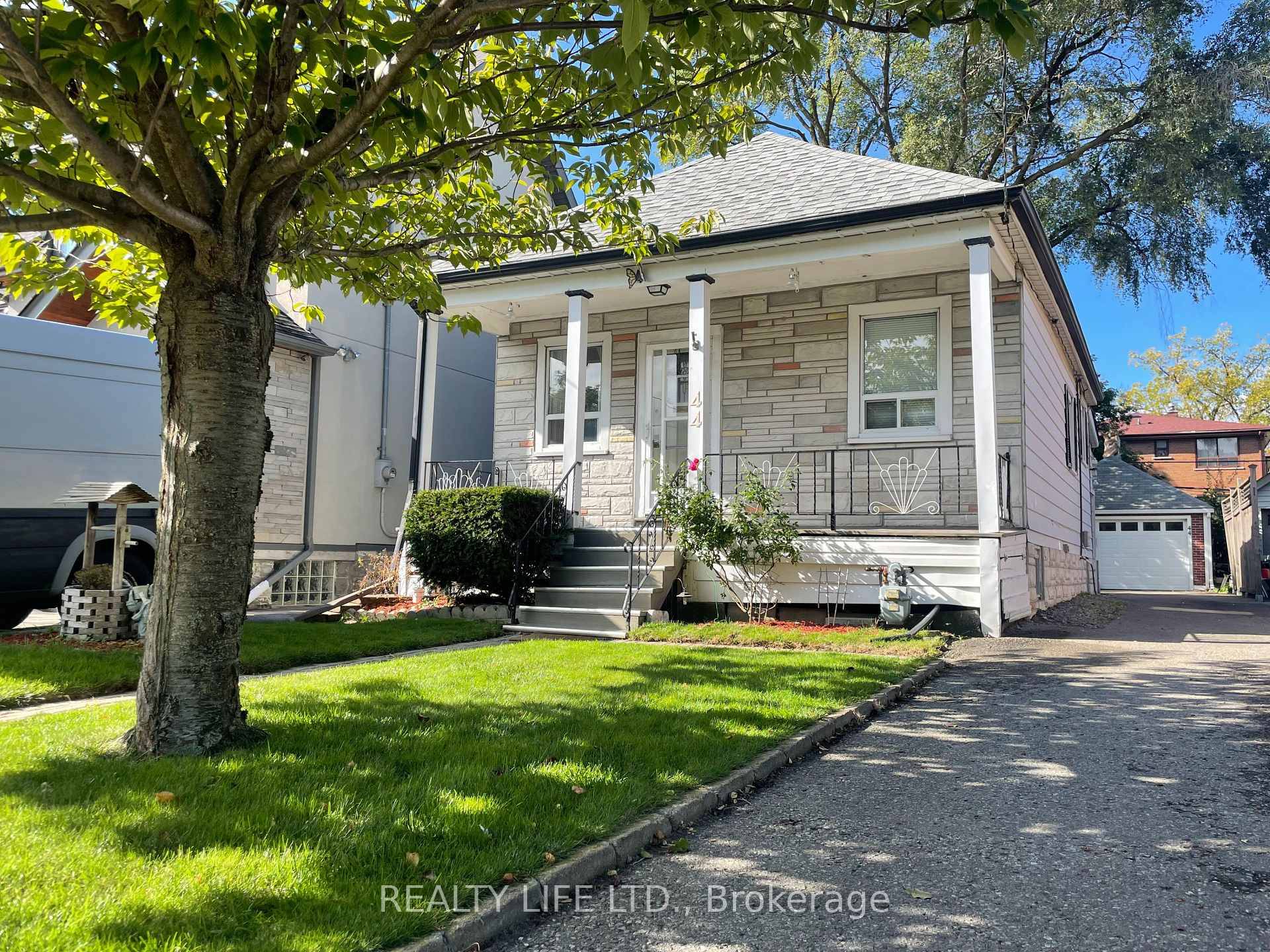 Detached Bungalow Set On A Large Desirable Lot Bright and Charming.