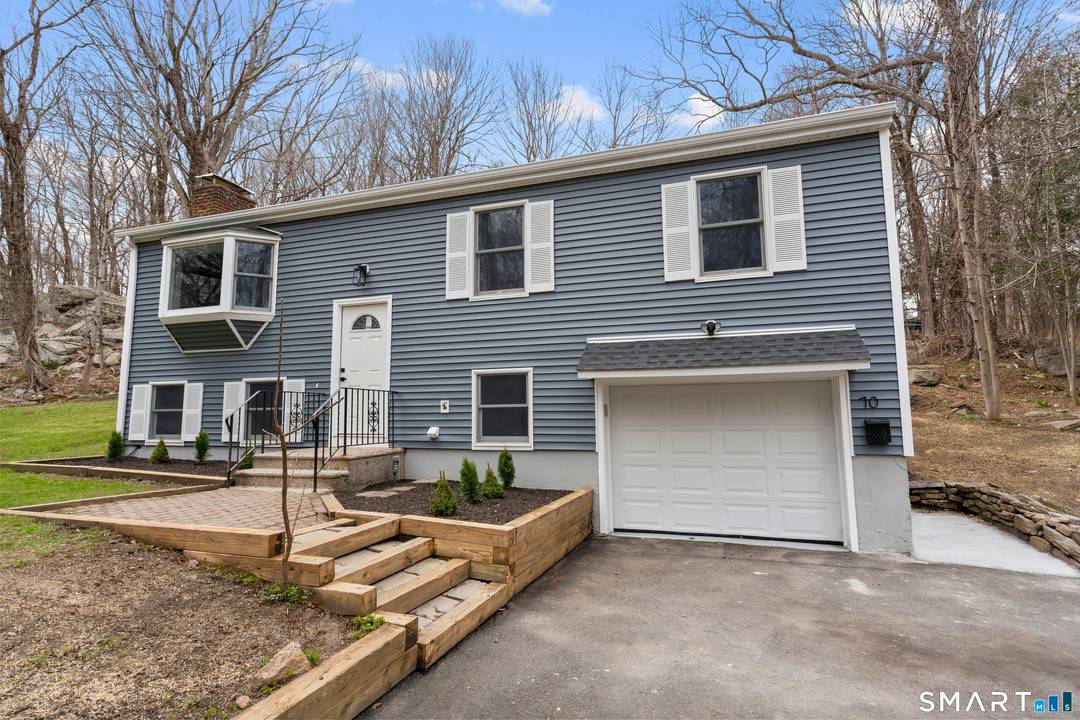 Welcome to your dream home located just steps from Devil's Den Park Trail.