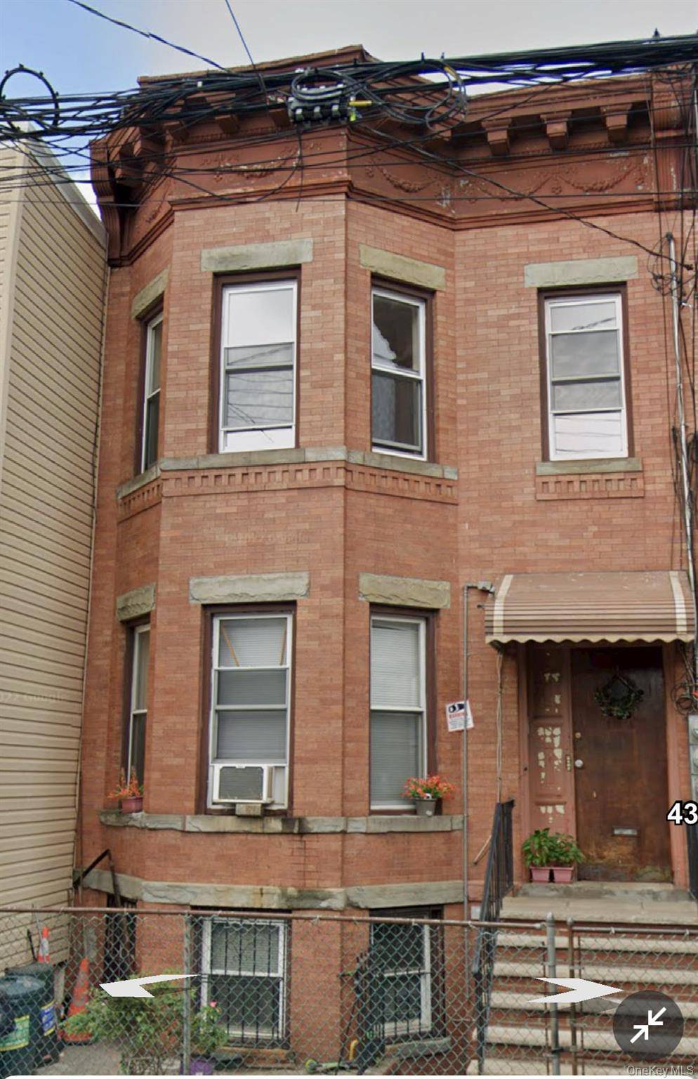 THIS 2 FAMILY BRICK ATTACHED 20X55 NEEDS TLC.