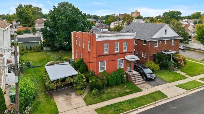 Welcome to 213 Adams Street in Linden, a legal two family brick home set on a 6, 000 sq ft lot with parking.