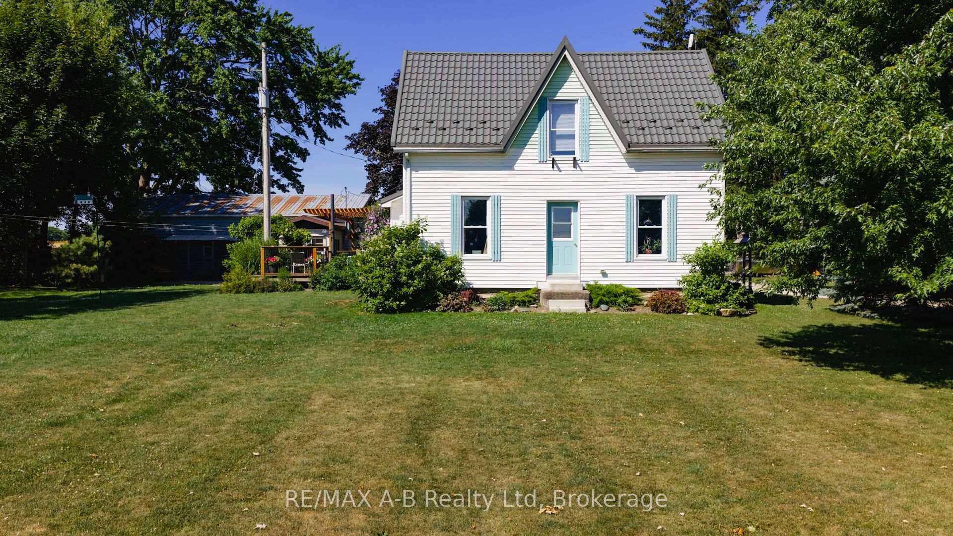 Discover the perfect blend of country charm and modern comfort on this picturesque 1.
