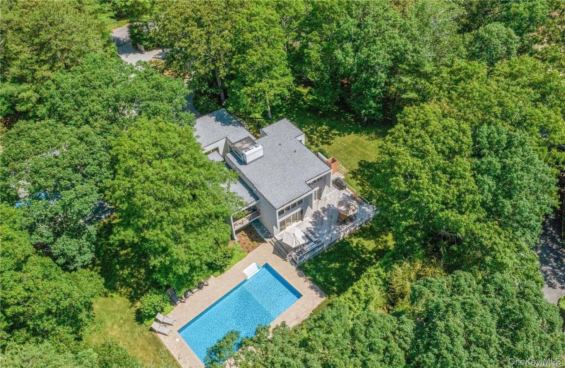 Quogue Enjoy this spacious multi level contemporary completely redone home on picturesque acre lot.