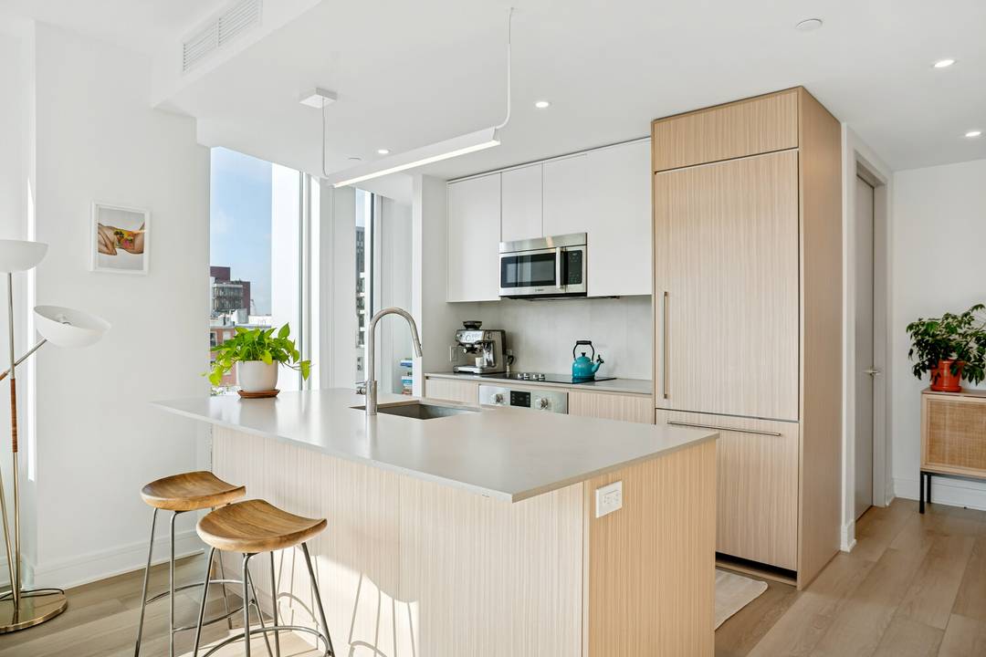 Spacious and sun filled, this two bedroom, two bathroom corner residence offers double exposure, floor to ceiling windows, and generous closet space throughout.