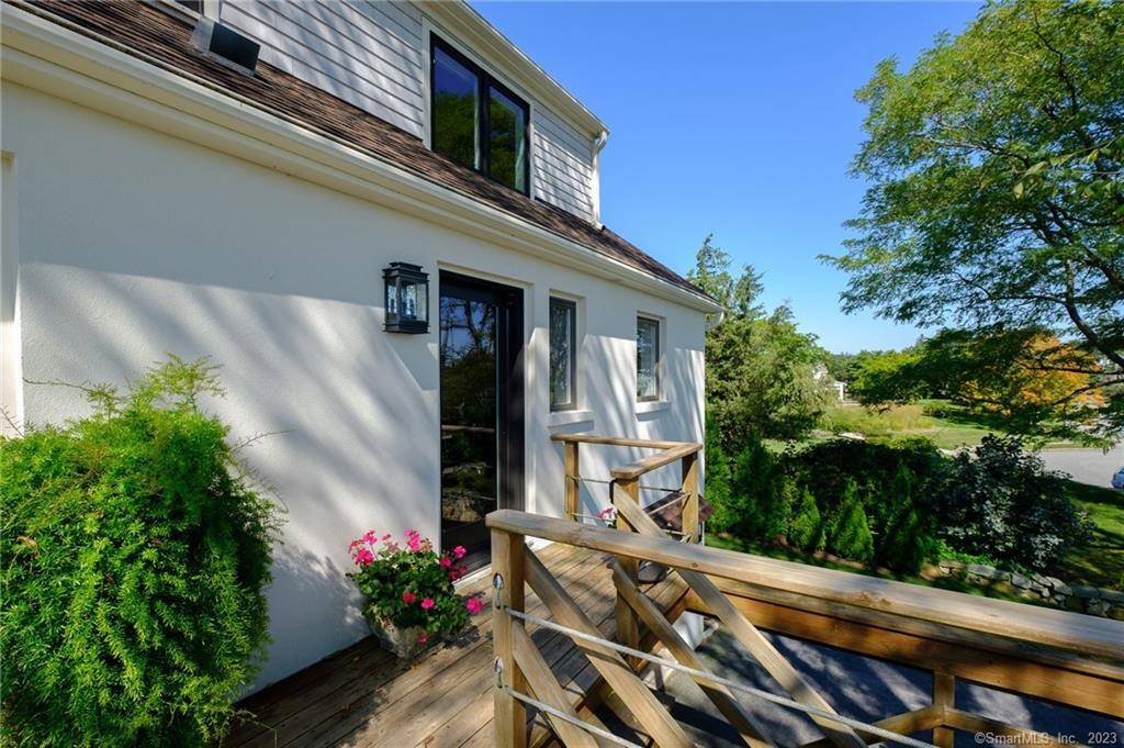 This gorgeous 4 bedroom 3 bath home sits on the CT water front with a beautifully landscaped park like property and two white sandy private beaches.