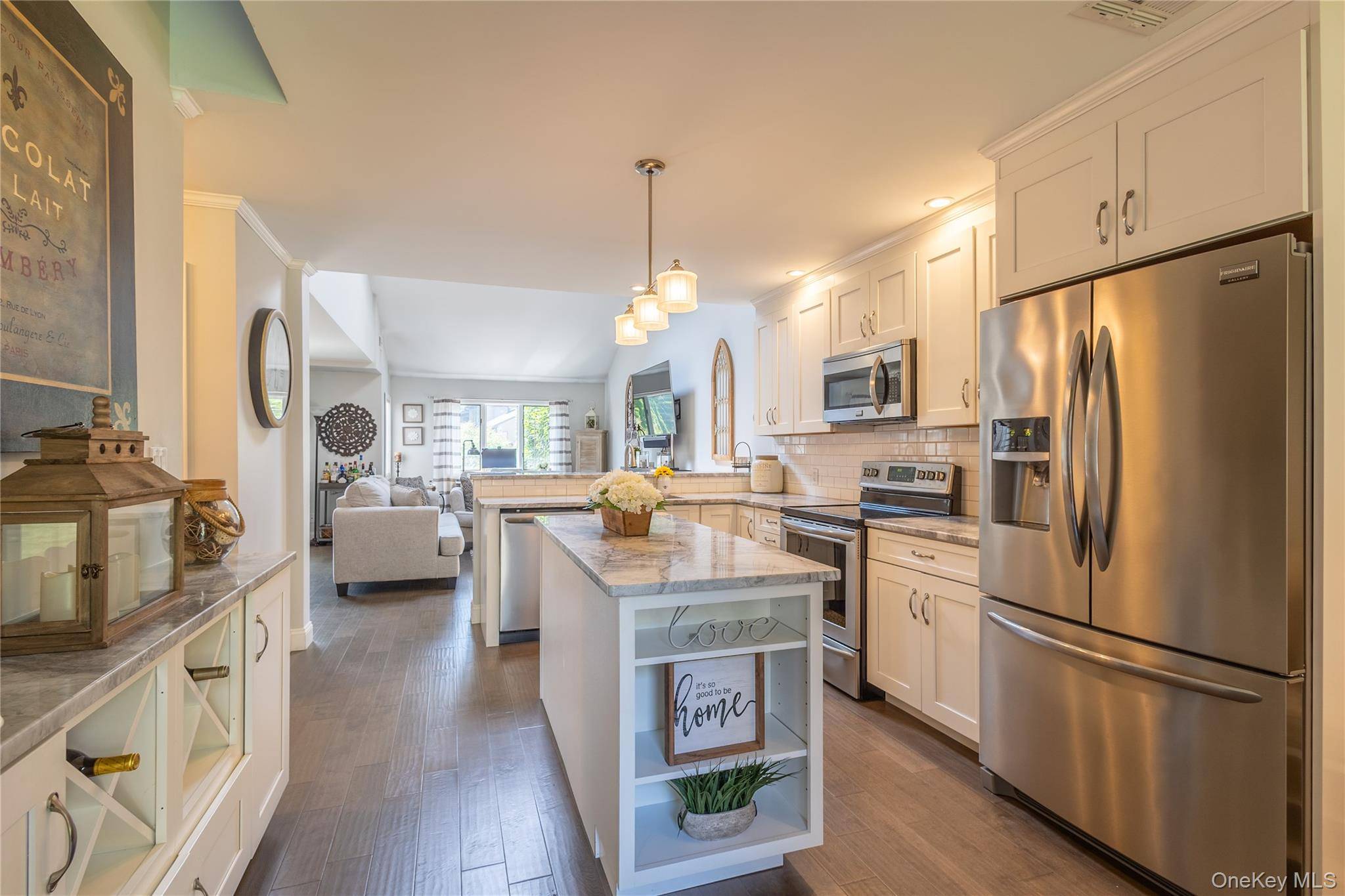 Just bring your toothbrush and come home to this stunning and completely updated spacious end unit nestled in the peaceful little enclave of The Woods Of Smithtown in the sought ...