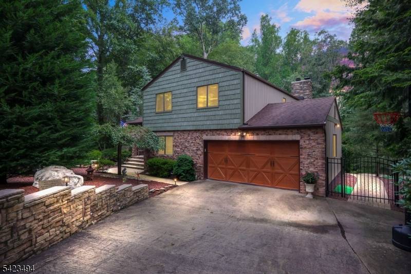Tucked away on a quiet cul de sac in East Freehold, this 5 bedroom, 3.