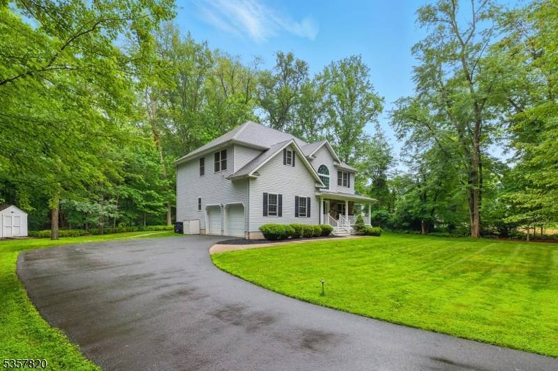 Better than new 10 year young colonial with high ceilings and open floorplan, close to everything, yet situated on a very private 3.