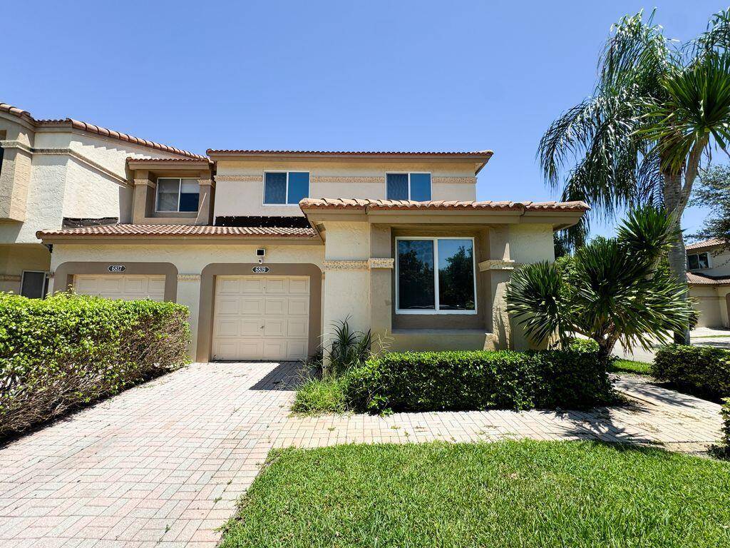 Fully Furnished Largest End Unit with Garage in Cortina, Boca Pointe.