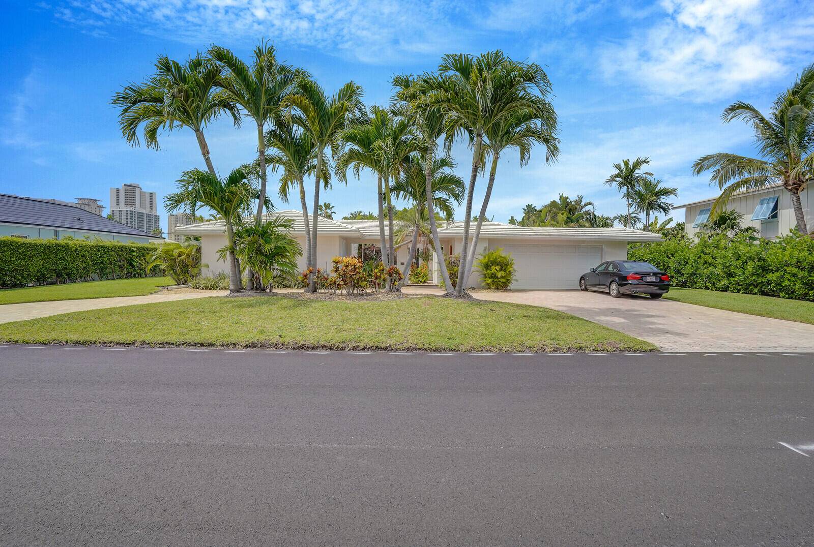 Located in the desirable neighborhood of Palm Beach Isles and one block from the beautiful Singer Island beach this 4 BR 3BA plus office pool home is the perfect place ...
