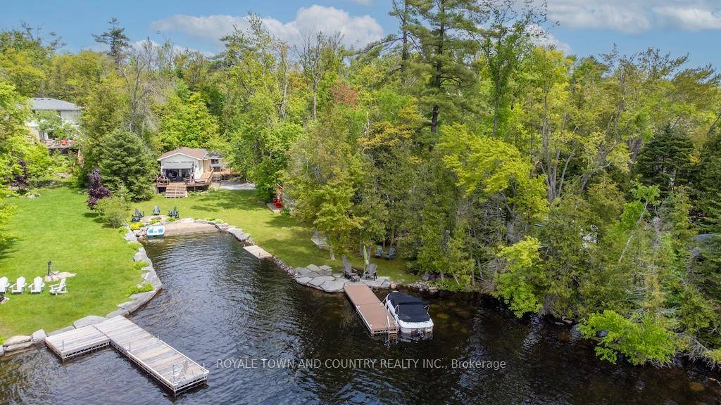 Escape to your own lakeside paradise with this charming, fully turn key 2 bedroom cottage, offering 173 feet of pristine shoreline on beautiful Lower Buckhorn Lake.
