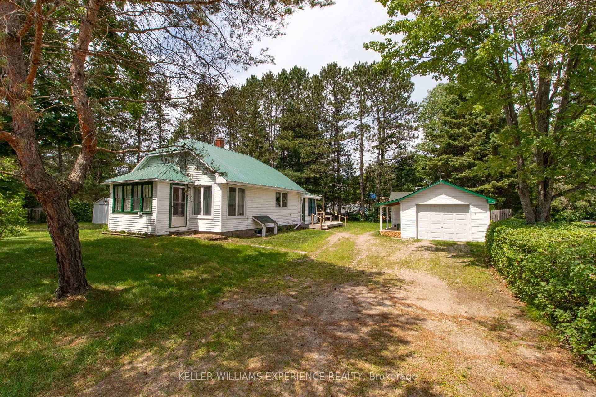Set on an oversized 132 x132 double lot with a horseshoe driveway, 152 Ottawa Avenue delivers the rare combination of in town convenience and country sized yard.