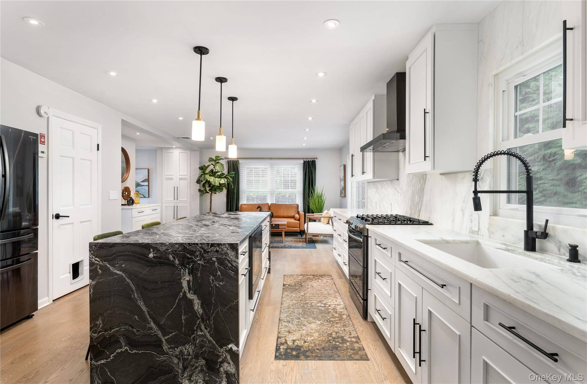 Completely remodeled to perfection, indulge in luxury living in this immaculate young colonial nestled in the heart of Port Jefferson Village less than half a mile from downtown.