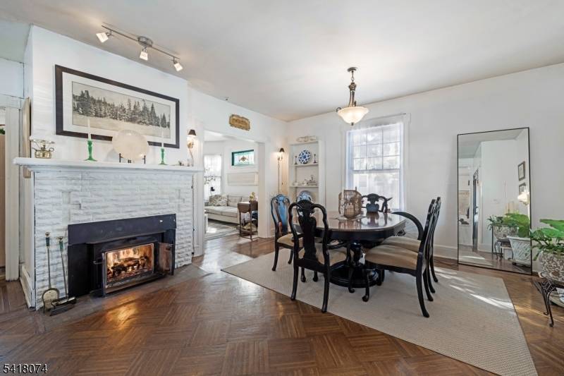 Handsome 1920s home full of spectacular original details set on wide, boulevard style street amongst other grand homes.