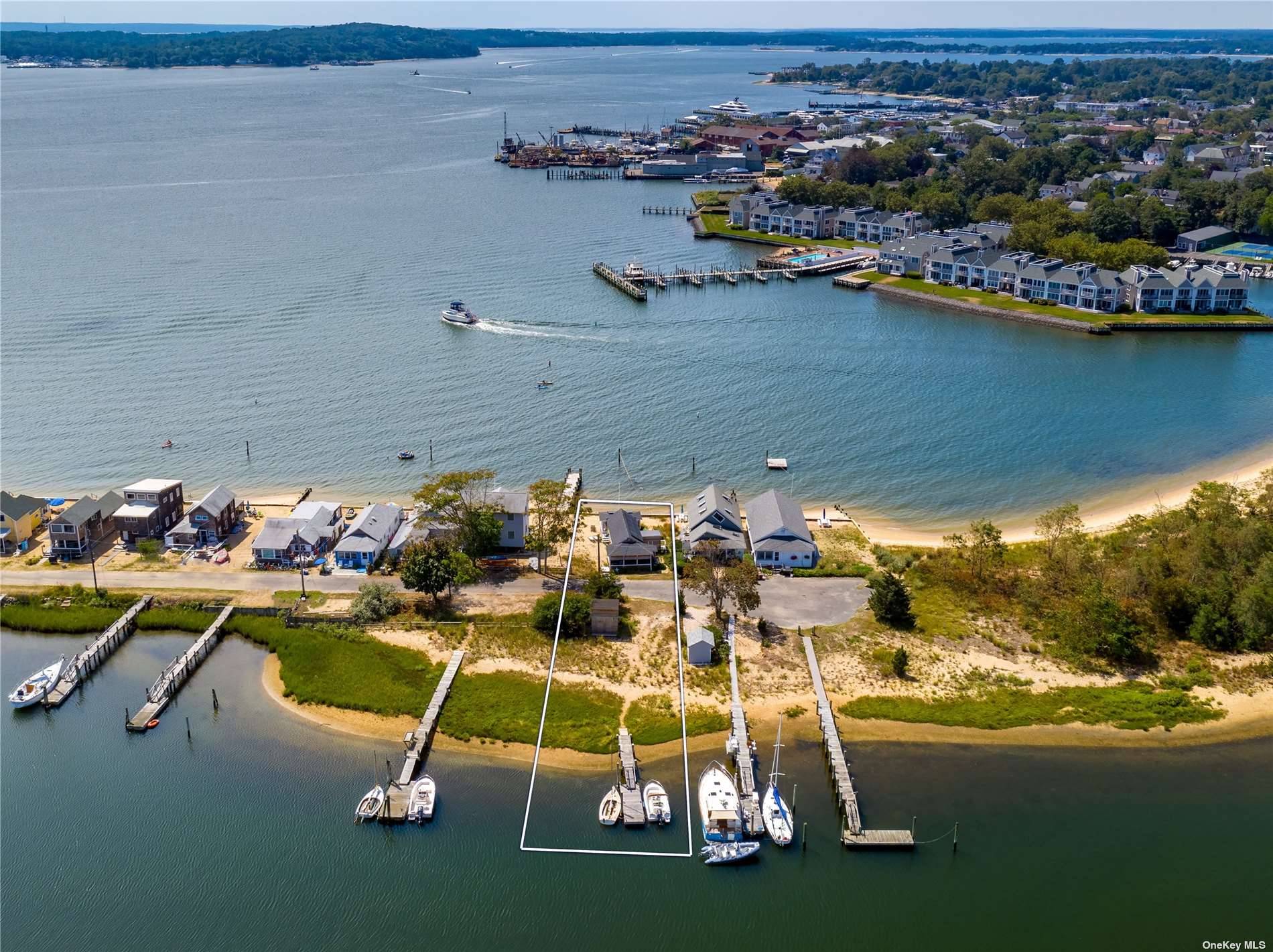 Take in exquisite views of the bay and Greenport Harbor from this light filled and hip beach cottage.