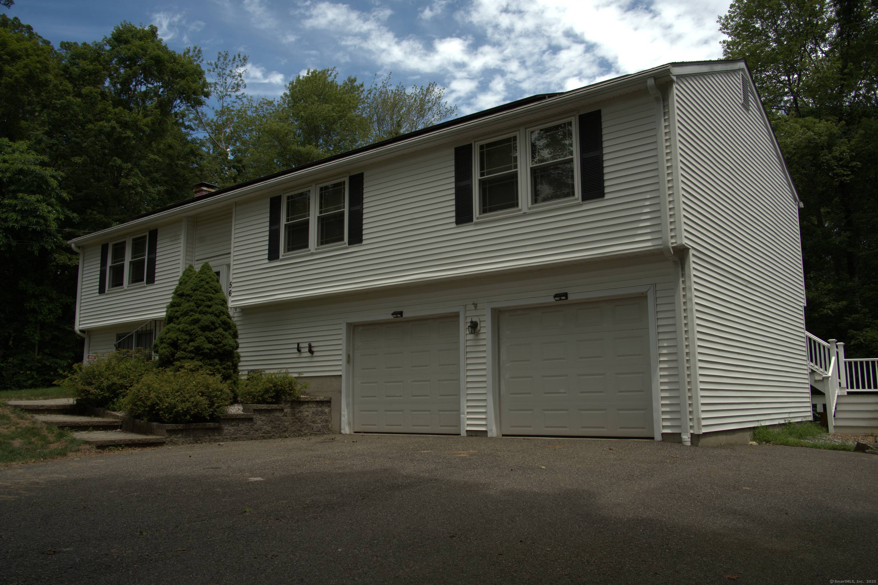 Welcome to this beautifully maintained raised ranch, perfectly situated on over an acre in the serene Great Hill neighborhood.