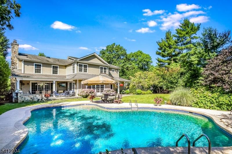 Set on a private. 43 acre property in the sought after Indian Forest neighborhood, this fully rebuilt and expanded 6 bedroom, 5.