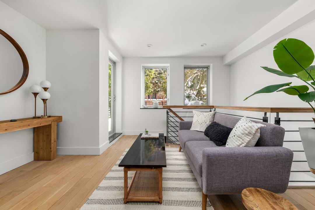 OPEN HOUSE IS BY APPOINTMENT ONLY Massive duplex with private garden, patio, and a huge storage room.