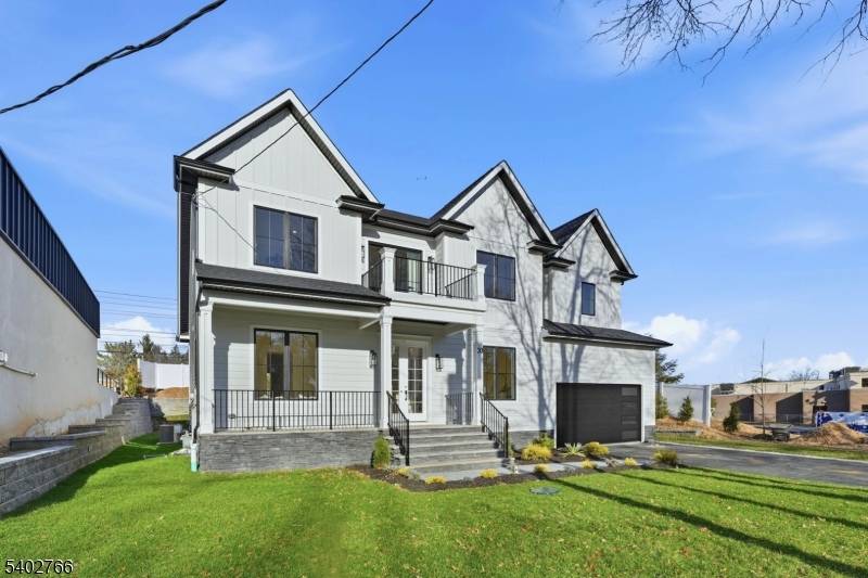 Stunning brand new construction offering 6 bedrooms and 5.