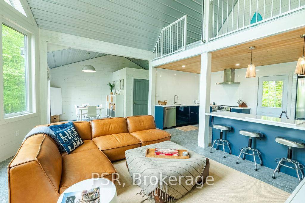 Welcome to 748 Big Island a newly built, beautifully finished cottage nestled on the coveted shores of Lake Vernon, part of Huntsville's desirable 4 lake chain.