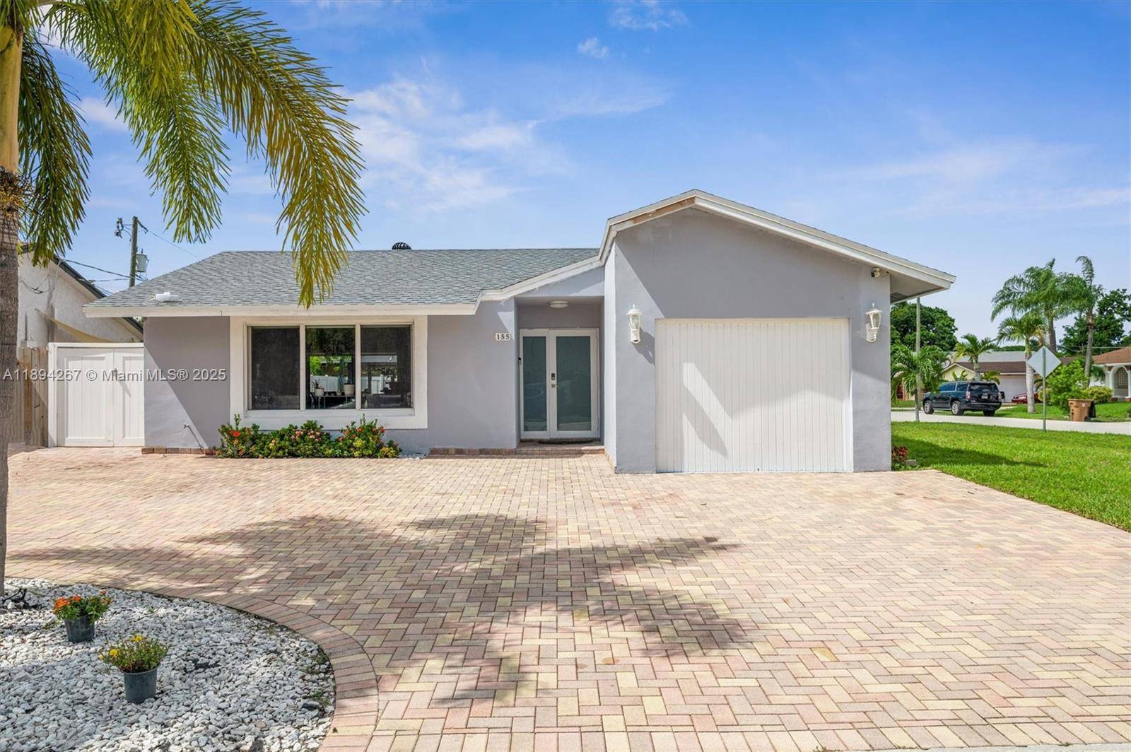 Welcome to 155 SW 32nd Terrace in central Deerfield Beach, a corner lot.