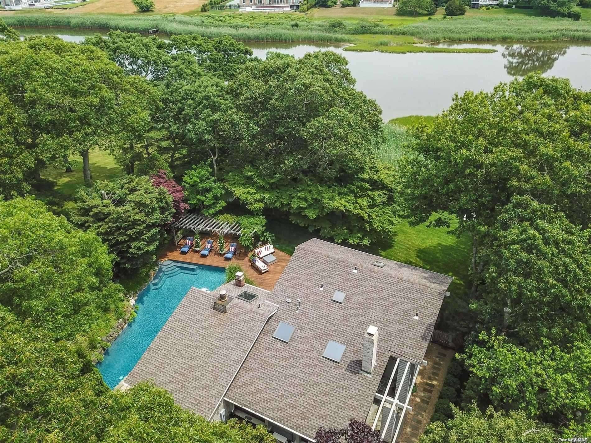 Behind The Gates Lies This Fabulous Mint Condition Home With A Beautiful Open Floorplan Overlooking The Water.