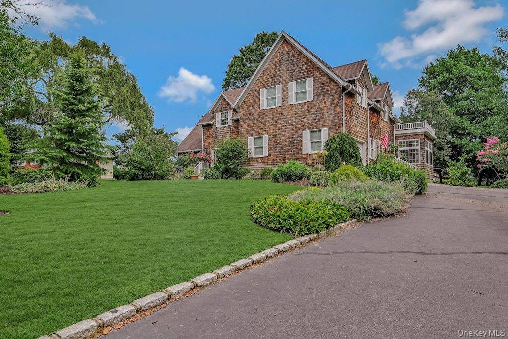 This beautiful custom built 2 story home is located minutes from a deeded beach and downtown Greenport with shops, wineries, boating, and golf.