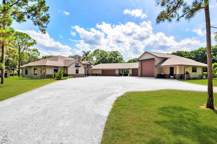 Welcome to this exceptional single story residence in the highly sought after Caloosa community of Palm Beach Gardens.
