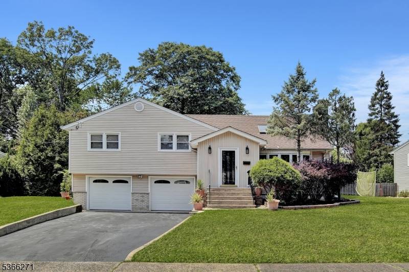 Tucked away on a quiet cul de sac, this freshly painted 4 bedroom, 3 full bath split level home offers immediate occupancy and a versatile layout.