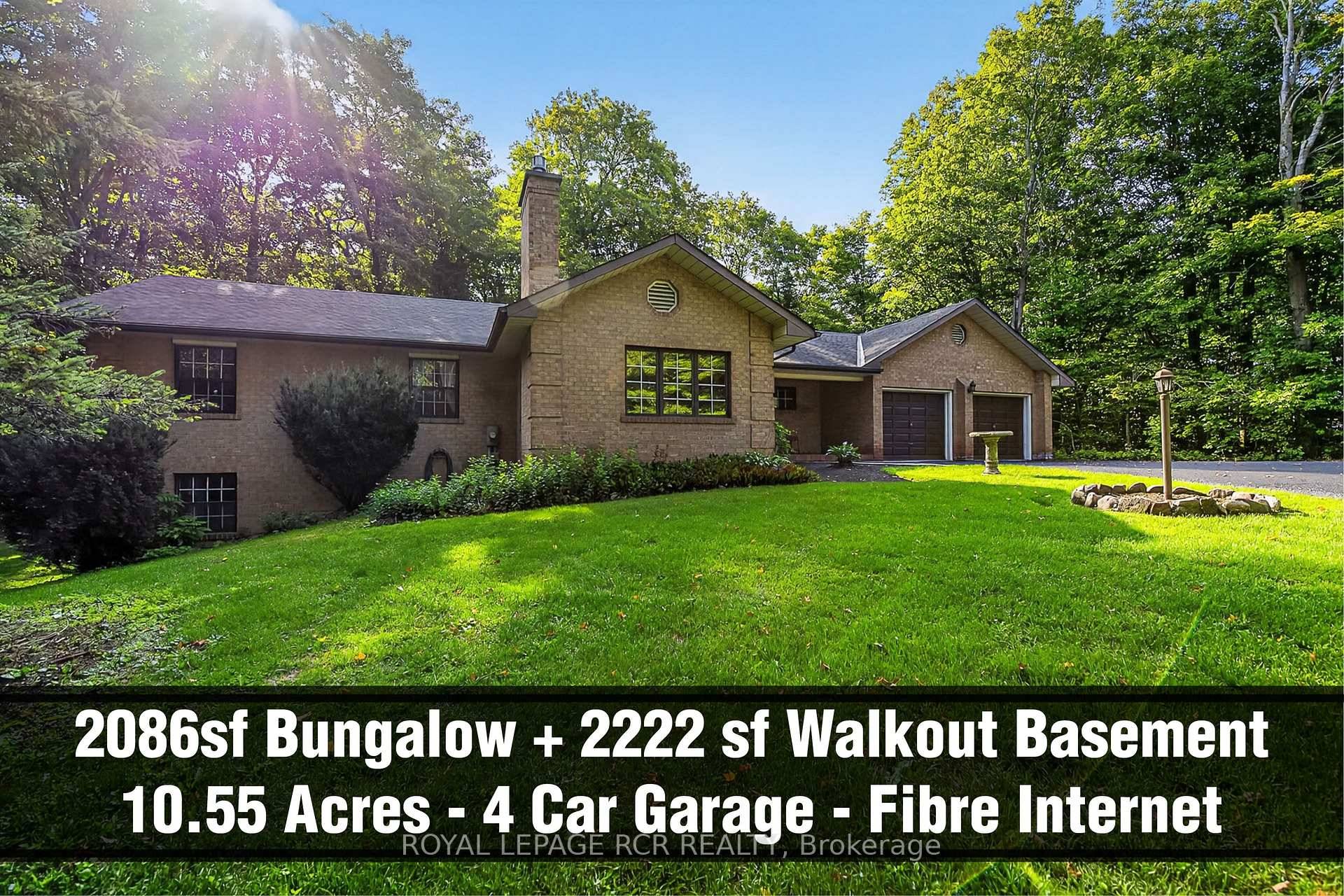 10. 55 Acres Fibre Optic Internet 3 1 bedroom Bungalow with side walk out finished basement with in law suite potential, 4 car garage and long private driveway.