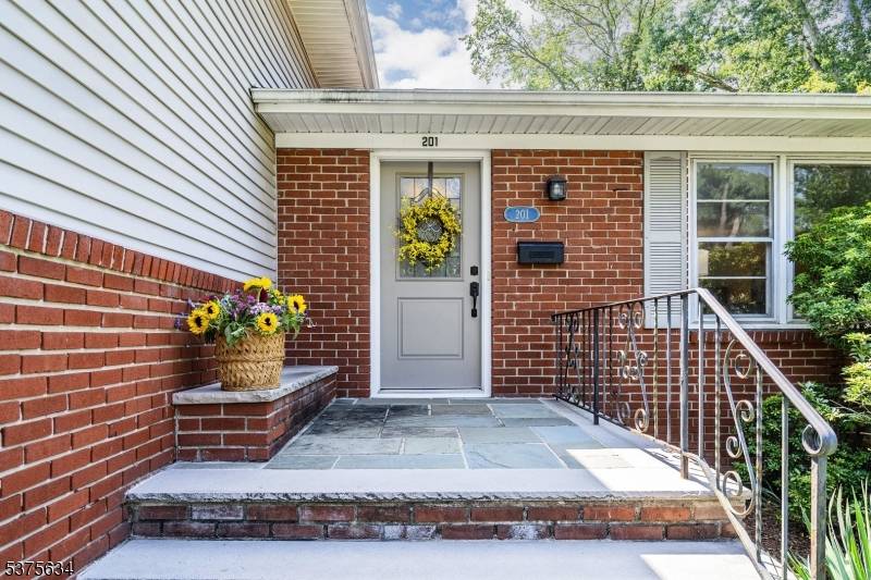 This Inviting Home offers Space, Nat'l Light Charm, perfectly situated in a Desirable Neighborhood !