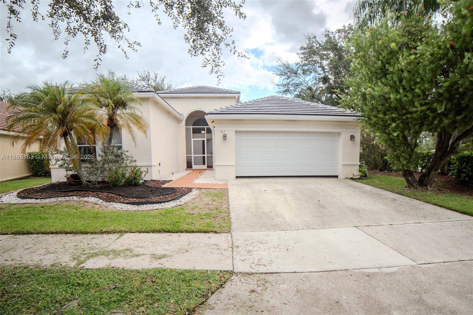 Beautiful 4 bedroom, 2. 5 bath corner home in the desirable gated community of North Lakes in Weston.