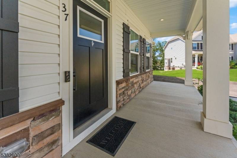 Welcome to 37 Esposito Lane, where elevated living meets modern convenience in the sought after Stone Water Village community of Morris County.