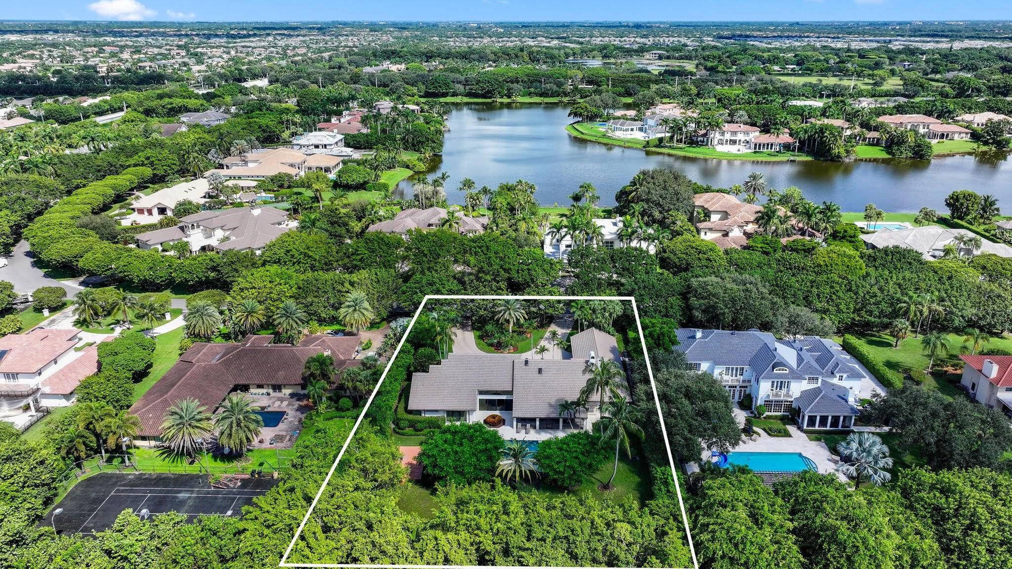 Experience luxury living at 18540 Long Lake Drive in Boca Raton's prestigious Long Lake Estates.