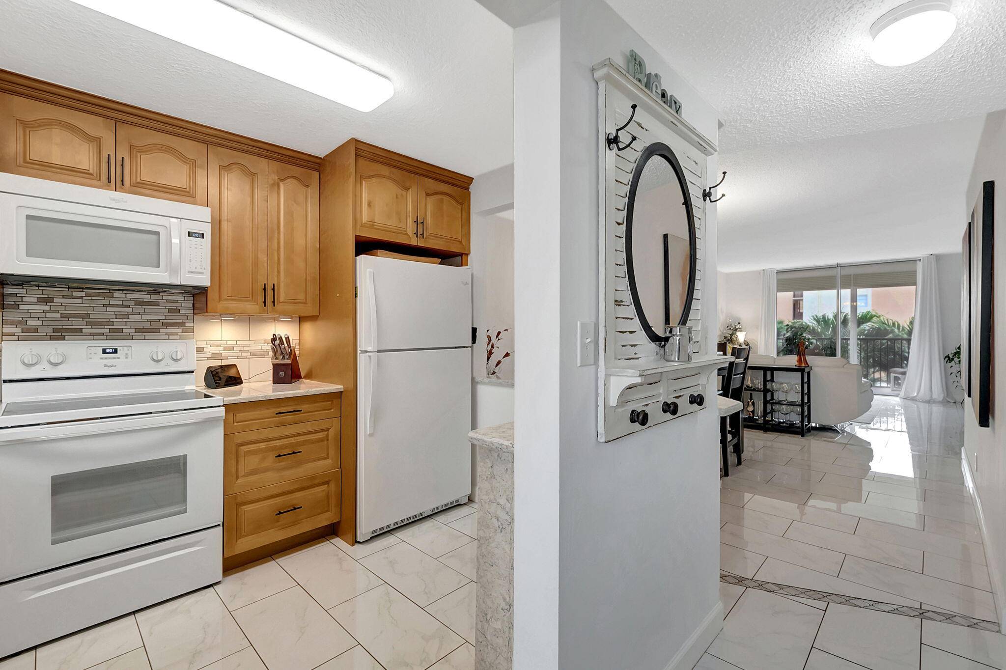 PRICE REDUCED ! This pristine, move in ready 2 bedroom 2 bath condo offers the perfect coastal lifestyle, situated on the Intracoastal Waterway across from Boynton Marina.