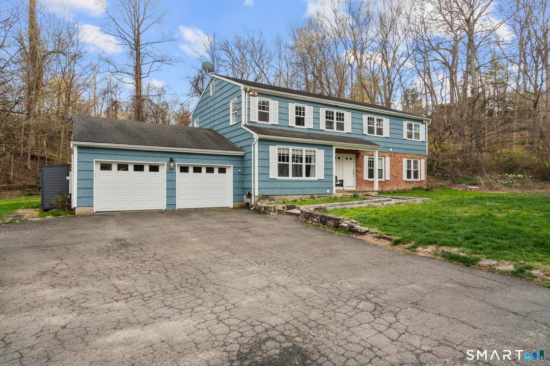 Located on scenic Long Ridge Road in Stamford, this property offers a unique blend of space, flexibility, and natural beauty.