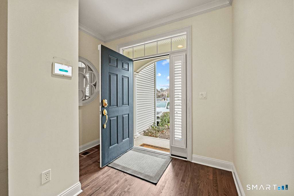 Elegant, light filled rarely available condo in sought after Quaker Green !